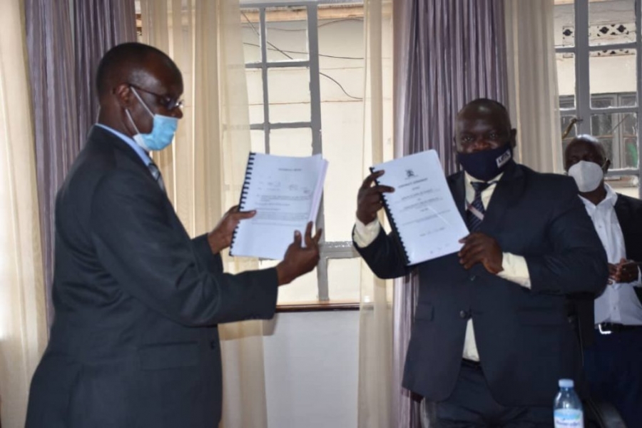 The signing of the contract for the Uganda Driver Licensing System between Ministry of Works &amp; Transport and Uganda Security Printing Company (USPC)